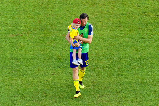 Gustav Svensson of Sweden with his child