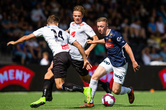 Ole Martin Rindarøy of Sogndal competes for the ball with