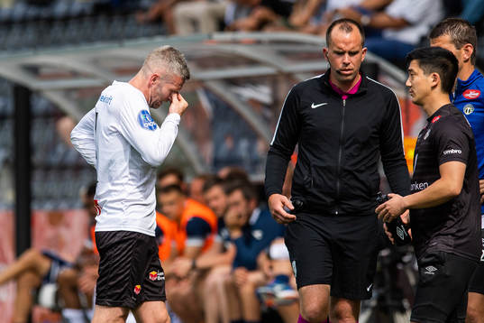 Kjetil Wæhler of Sogndal leaves the pitch due to injury