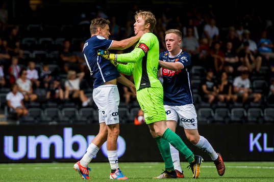 Tommy Høiland of Viking and Goalkeeper Mathias Dyngeland