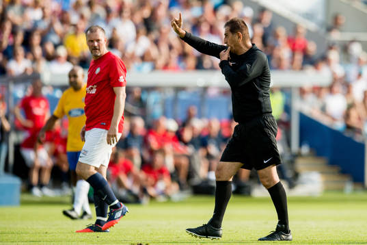 Kjetil Rekdal of Norway and Esse Baharmast, referee