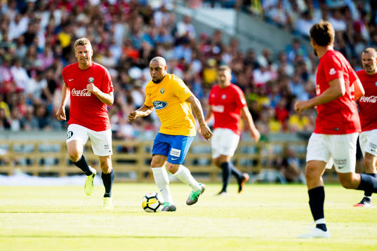 Jostein Flo of Norway and Roberto Carlos of Brazil