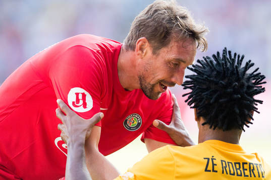 Vidar Riseth of Norway and Zé Roberto of Brazil