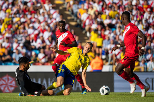 Viktor Claesson of Sweden and goalkeeper Pedro Gallese of