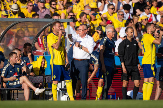Ola Toivonen of Sweden is given instructions by Janne