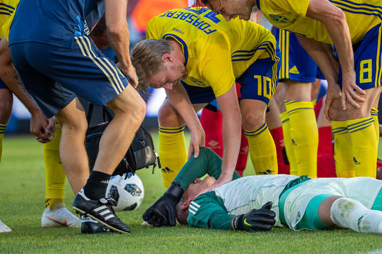 Goalkeeper Robin Olsen of Sweden lies down