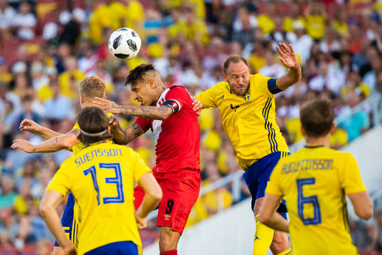 Oscar Hiljemark and Andreas Granqvist of Sweden competes