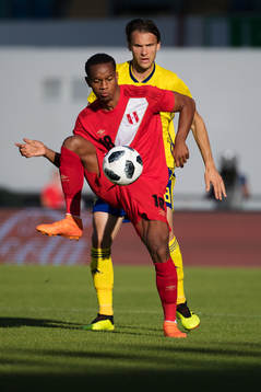 André Carrillo of Peru and Albin Ekdal of Sweden