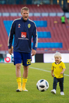 Ola Toivonen of Sweden plays with one of his kids