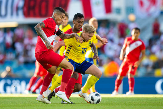 Emil Forsberg of Sweden competes for the ball with Paolo