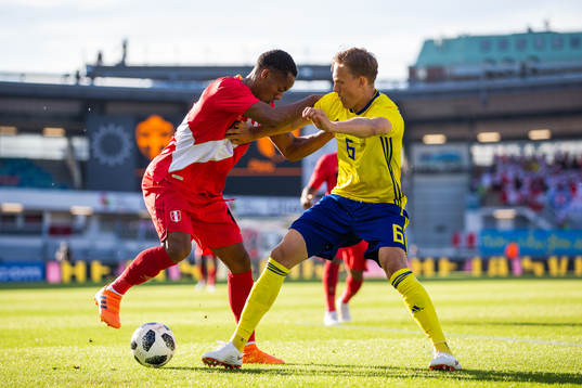 André Carrillo of Peru competes for the ballwith Ludwig