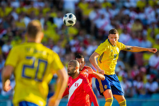 Marcus Berg of Sweden with a header