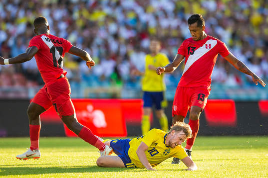 Emil Forsberg of Sweden falls in a duell with Luis