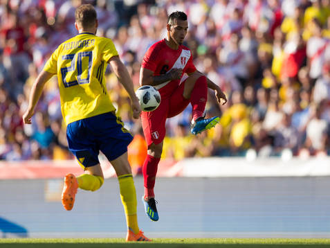 Ola Toivonen of Sweden and Miguel Trauco of Peru