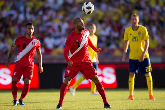 Albert Rodriguez of Peru with a header