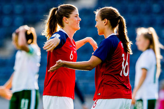 Maren Mjelde and Guro Reiten of Norway celebrate