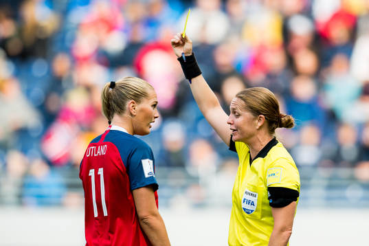 Lisa-Marie Karlseng Utland of Norway is given a yellow card