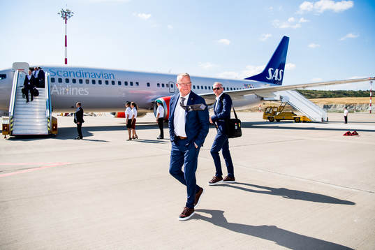 Head coach Janne Andersson walks in front of the plane when