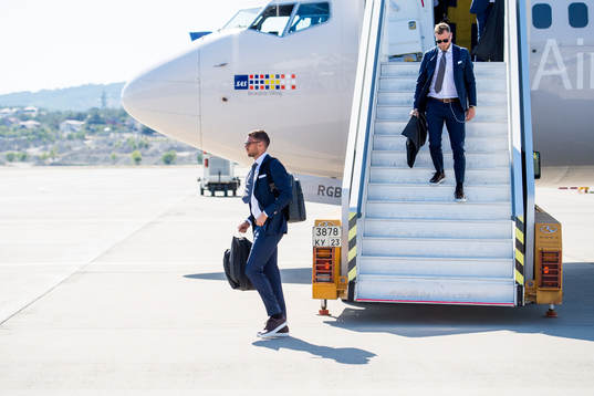 Marcus Berg and John Guidetti of Sweden disembark the plane