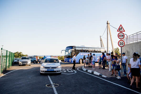 The Swedish team bus is escorted by police to the practice