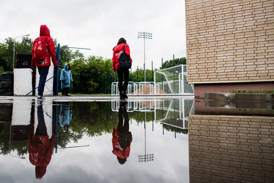 Volunteers is reflected in a puddle