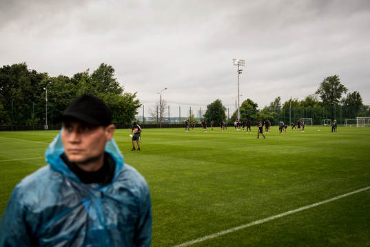 A police standing guard in front of Mexico practice session