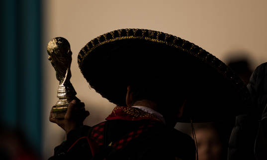 A copy of the World Cup Trophy is seen in the stands
