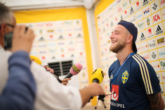 John Guidetti of the Swedish national football team laughs