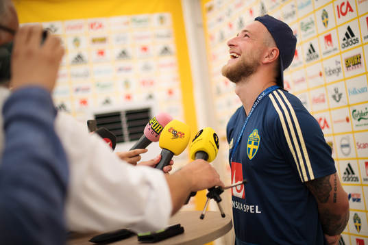 John Guidetti of the Swedish national football team laughs