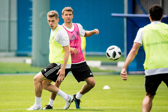Matthias Ginter and Thomas Muller of Germany