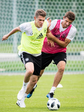 Matthias Ginter and Thomas Muller of Germany