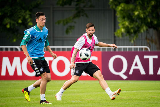 Mesut Oezil and Marvin Plattenhardt of Germany