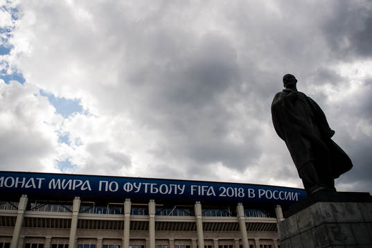 A statue of Vladimir Lenin stands in front of Luzhniki