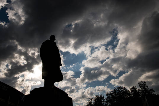 A statue of Vladimir Lenin stands in front of Luzhniki