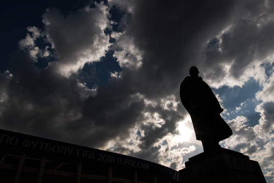 A statue of Vladimir Lenin stands in front of Luzhniki