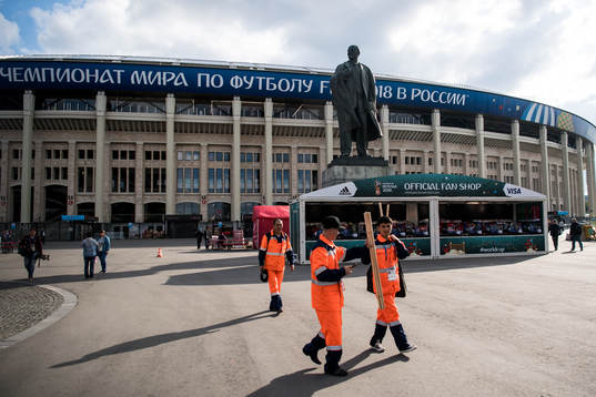 A statue of Vladimir Lenin stands in front of Luzhniki