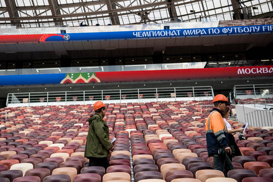 Workers in the stands at Luzhniki Stadium