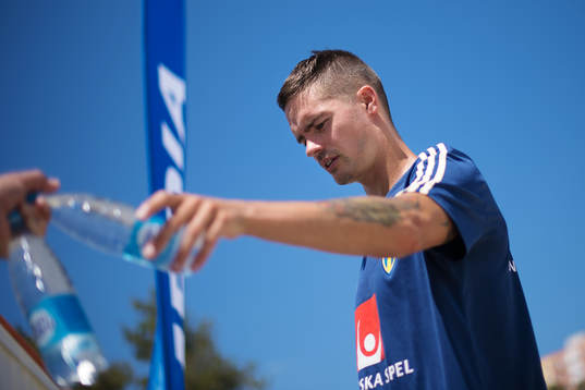 Mikael Lustig of the Swedish national football team reaches