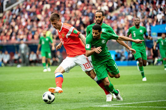 Fedor Smolov of Russia and Taiseer Aljassam of Saudiarabia