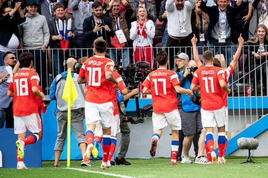Denis Cheryshev of Russia celebrates with his teammates