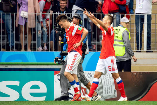 Denis Cheryshev of Russia celebrates with his teammates