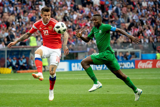Fedor Smolov of Russia and Osama Hawsawi of Saudiarabia