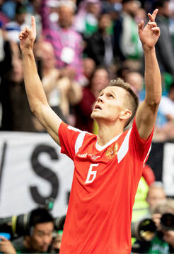Denis Cheryshev of Russia celebrates