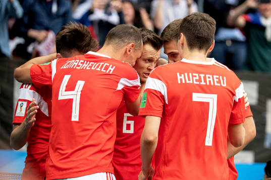 Denis Cheryshev of Russia celebrates with his teammates