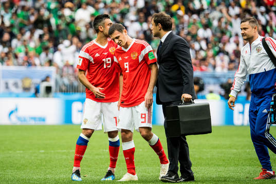 Alan Dzagoev of Russia goes off the pitch
