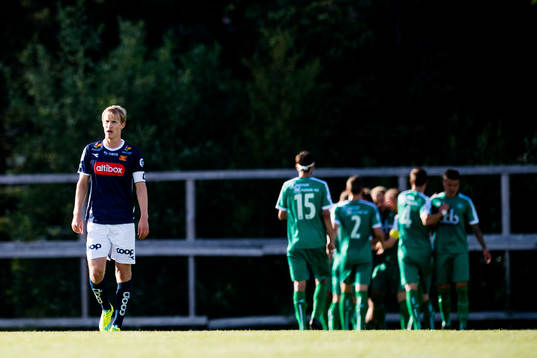 Viljar Vevatne of Viking looks dejected while the players