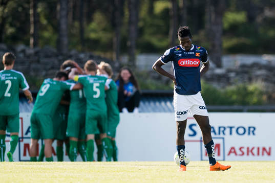 Usman Sale of Viking looks dejected while the players of