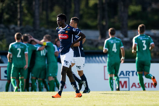 Usman Sale of Viking looks dejected while the players of