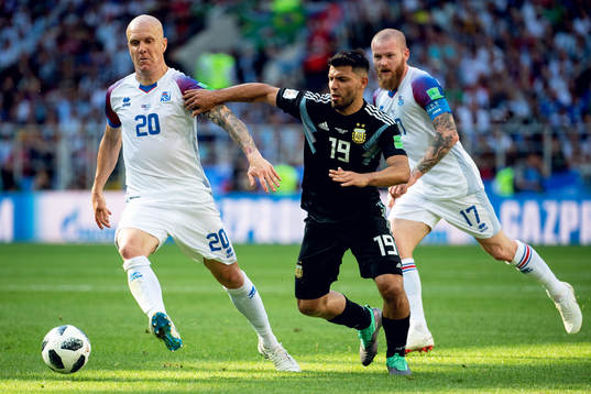 Emil Hallfredsson of Iceland and Sergio Aguero of Argentina