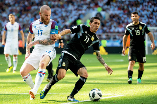 Aron Gunnarsson of Iceland and Angel Di Maria of Argentina